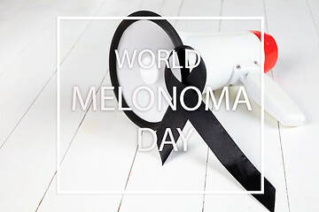 Image showing Black ribbon-symbol of fight against melanoma and skin cancer.