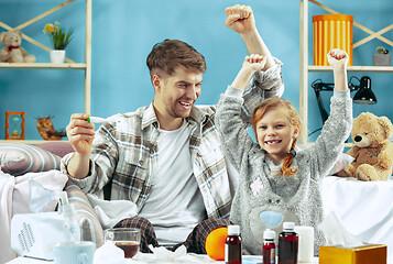 Image showing Sick man with daughter at home. The ill family.