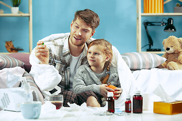 Image showing Sick man with daughter at home. The ill family.