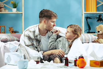 Image showing Sick man with daughter at home. The ill family.