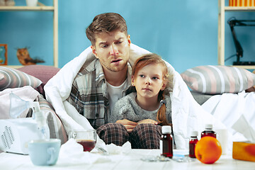 Image showing Sick man with daughter at home. The ill family.