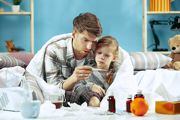 Image showing Sick man with daughter at home. The ill family.