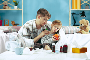 Image showing Sick man with daughter at home. The ill family.