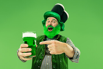 Image showing A man in a leprechaun hat at studio. He celebrates St. Patrick\'s Day.