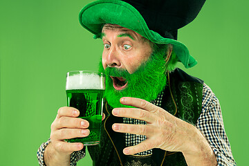 Image showing A man in a leprechaun hat at studio. He celebrates St. Patrick\'s Day.