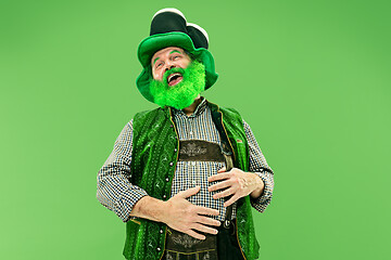 Image showing A man in a leprechaun hat at studio. He celebrates St. Patrick\'s Day.