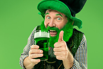 Image showing A man in a leprechaun hat at studio. He celebrates St. Patrick\'s Day.