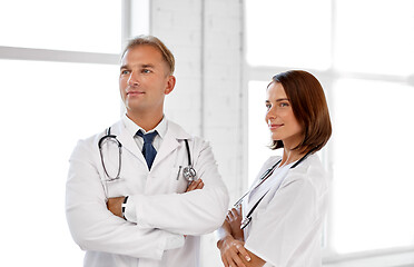 Image showing smiling doctors in white coats at hospital