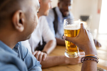 Image showing male friends drinking beer at bar or pub