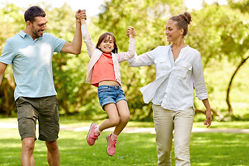 Image showing happy family walking in summer park