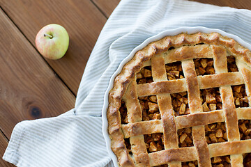 Image showing apple pie in baking mold on wooden table