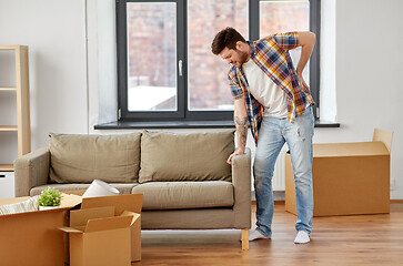 Image showing man having back ache moving to new home