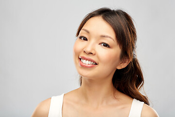 Image showing face of happy smiling young asian woman