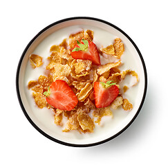 Image showing sweet cornflakes with milk and strawberries