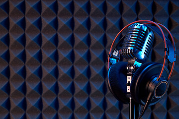 Image showing Studio condenser microphone with professional headphones acoustic panel