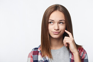 Image showing Closeup portrait of thinking teen girl looking to side