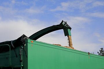 Image showing Wood Chipper Loading onto Trailer