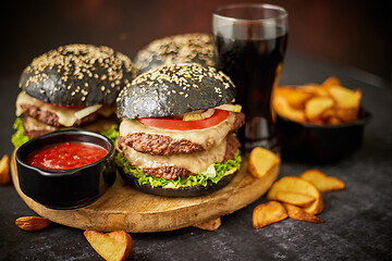 Image showing Delicious black hamburger with patties and cheese