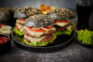 Image showing Delicious black hamburger with patties and cheese