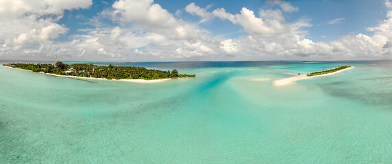 Image showing Picture perfect beach and turquoise lagoon on small tropical island on Maldives