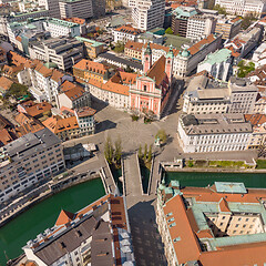 Image showing Aerial drone view of Preseren Squere and Triple Bridge over Ljubljanica river,Tromostovje, Ljubljana, Slovenia. Empty streets during corona virus pandemic social distancing measures