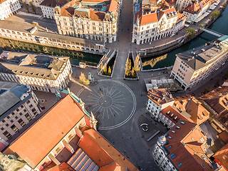 Image showing Aerial drone view of Preseren Squere and Triple Bridge over Ljubljanica river,Tromostovje, Ljubljana, Slovenia. Empty streets during corona virus pandemic social distancing measures