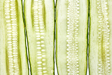 Image showing Vertical cut cucumber vegetable slices natural background.