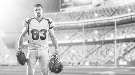 Image showing American Football Player isolated on big modern stadium field