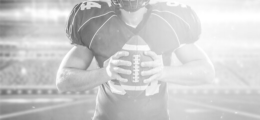 Image showing American Football Player isolated on big modern stadium field