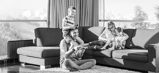 Image showing Happy family playing a video game