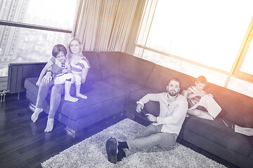 Image showing Happy Young Family Playing Together on sofa