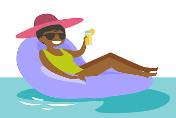 Image showing African-american woman relaxing in swimming pool.