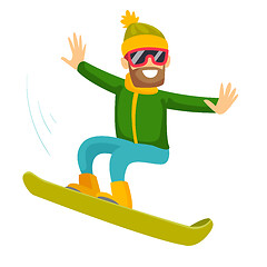 Image showing Young caucasian white man riding a snowboard.