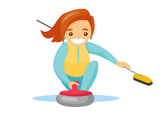 Image showing Caucasian sportswoman playing curling on ice rink.