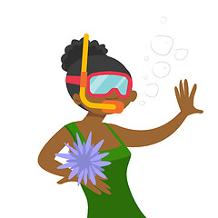 Image showing Young african-american woman swimming underwater.