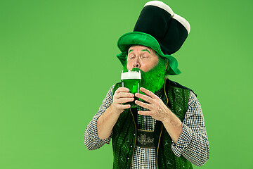 Image showing A man in a leprechaun hat at studio. He celebrates St. Patrick\'s Day.