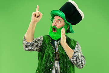 Image showing A man in a leprechaun hat at studio. He celebrates St. Patrick\'s Day.