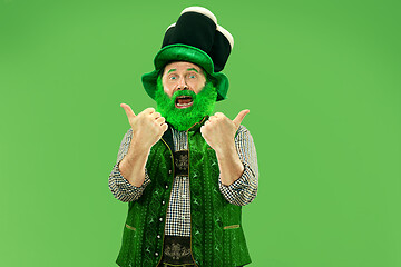 Image showing A man in a leprechaun hat at studio. He celebrates St. Patrick\'s Day.