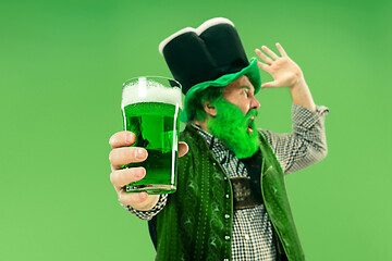 Image showing A man in a leprechaun hat at studio. He celebrates St. Patrick\'s Day.