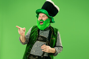 Image showing A man in a leprechaun hat at studio. He celebrates St. Patrick\'s Day.