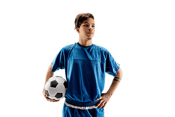 Image showing Young fit boy with soccer ball standing isolated on white