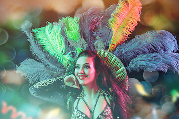 Image showing Beautiful young woman in carnival peacock costume