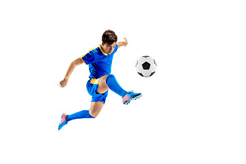 Image showing Young boy with soccer ball doing flying kick