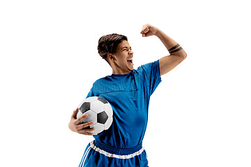 Image showing Young fit boy with soccer ball standing isolated on white