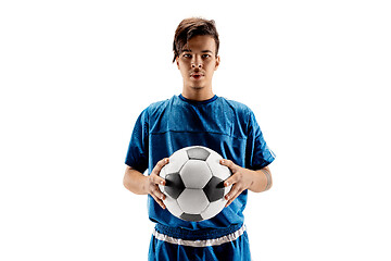 Image showing Young fit boy with soccer ball standing isolated on white