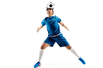 Image showing Young boy with soccer ball doing flying kick