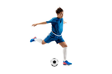 Image showing Young boy with soccer ball doing flying kick