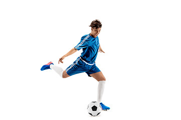 Image showing Young boy with soccer ball doing flying kick