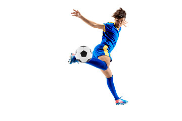 Image showing Young boy with soccer ball doing flying kick