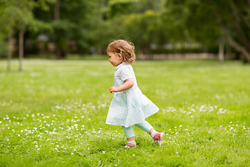 Image showing happy little baby girl running at park in summer